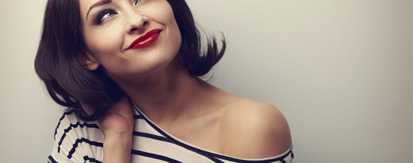 Happy short hair makeup woman thinking and looking up in modern blouse. Vintage closeup portrait