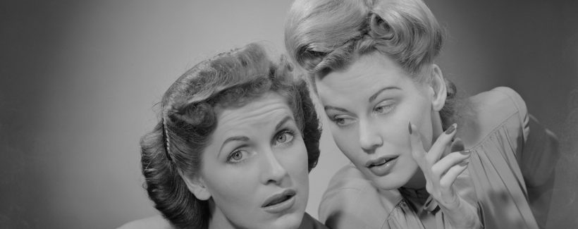 Two women talking indoors